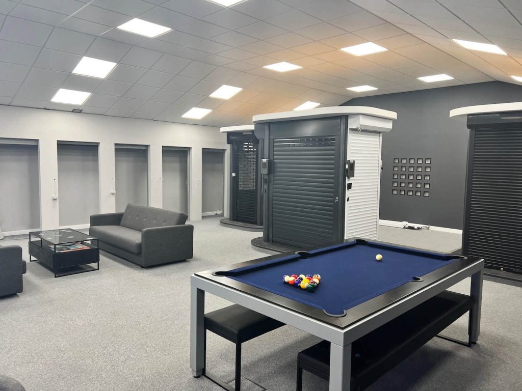 aluroll showroom with pool table and garage doors in action